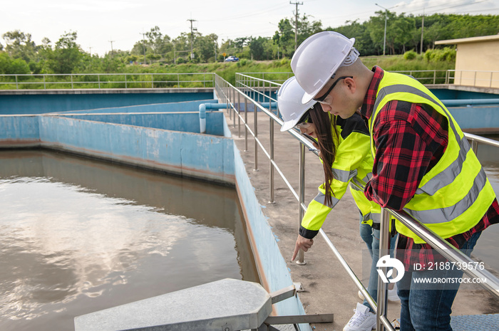 Environmental engineers work at wastewater treatment plants,Water supply engineering working at Water recycling plant for reuse,Technicians and engineers discuss work together.