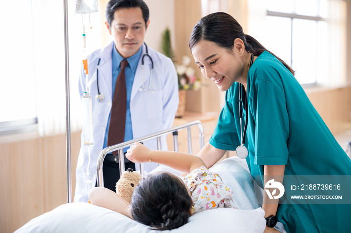 Pediatrician visiting parents and child in hospital bed ward, doctor and nurse meet and talking with patient kid, healthcare medical service treatment process concept