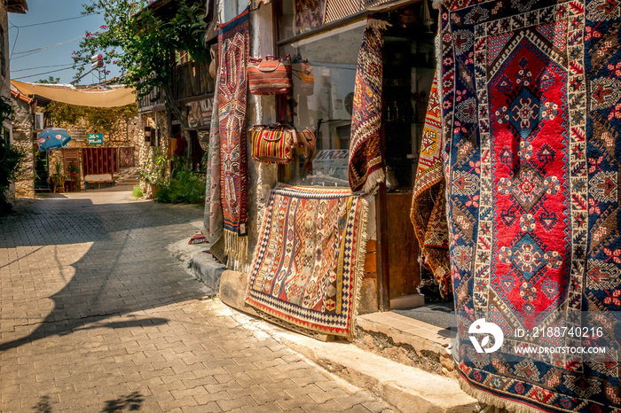 Turkish Rugs for sale, hanging outside in the Turkish Sunshine of Kekova Roads.