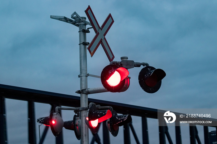 Flashing Railway Crossing With Train Passing