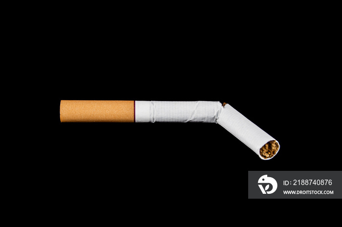 broken cigarette on isolated black background