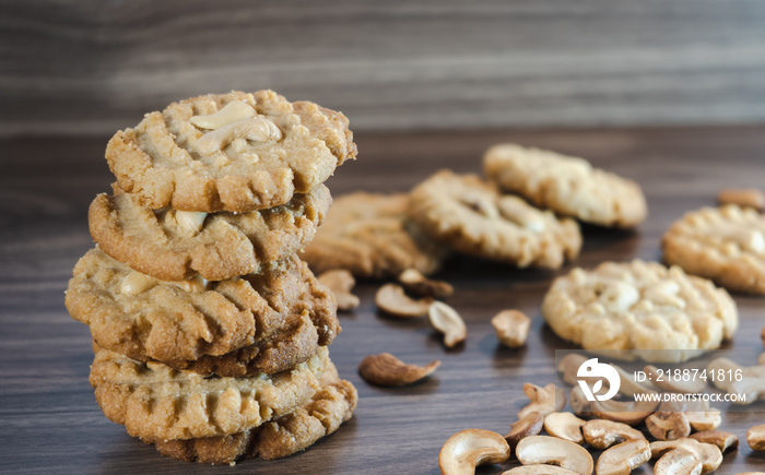 Keto cookies and cashews arranged on a wooden container