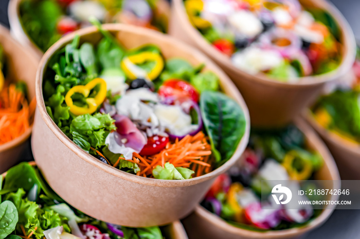 Paper boxes with pre-packaged vegetable salads ready for sale