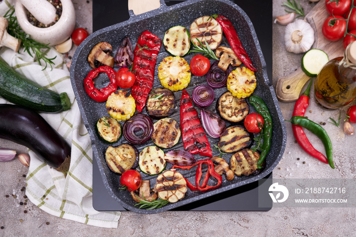 Grilled vegetables on grill pan at domestic kitchen