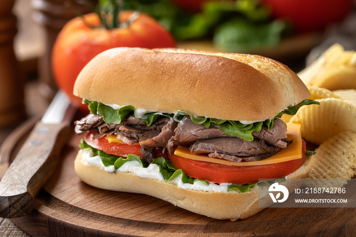 Roast beef sandwich with cheese, tomato and lettuce