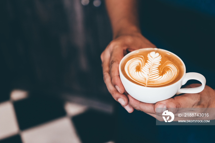 Cup of coffee latte art with coffee shop.