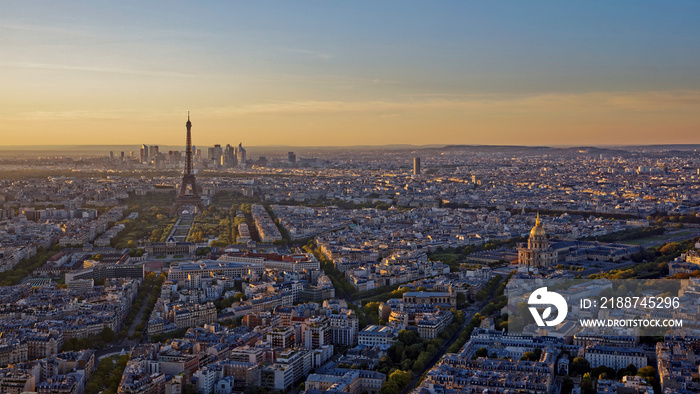 Eiffel Tower, Les Invalides and business district of Defense at orange sunset, as seen from Montparnasse Tower, Paris, France