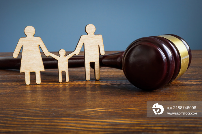 Family law and adoption concept. Figures and gavel.