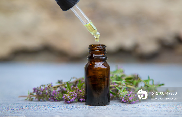 Thyme extract essential oil. Selective focus. nature.