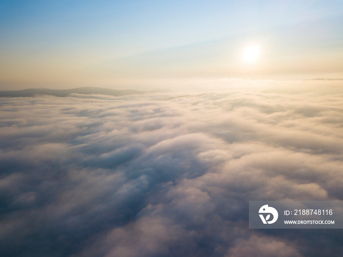 High flight above the clouds. Aerial drone view.