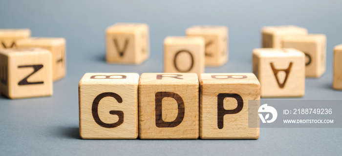 Wooden blocks with the word GDP ( Gross domestic product ). Financial measure of the market value of all the final goods and services produced in a specific time period.