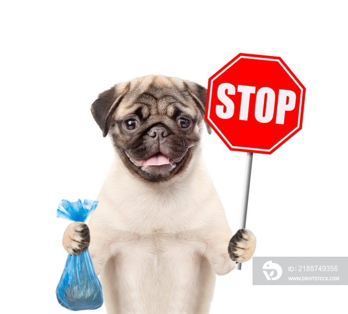 puppy holds plastic bag and road sign  stop . Concept cleaning up dog droppings. isolated on white background