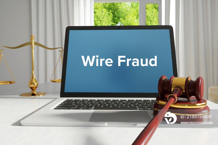 Wire Fraud – Law, Judgment, Web. Laptop in the office with term on the screen. Hammer, Libra, Lawyer.