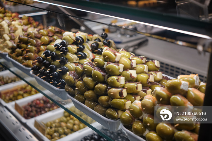 typical food in spain - Spanish food tapas display at Mercado de San Miguel market Madrid.