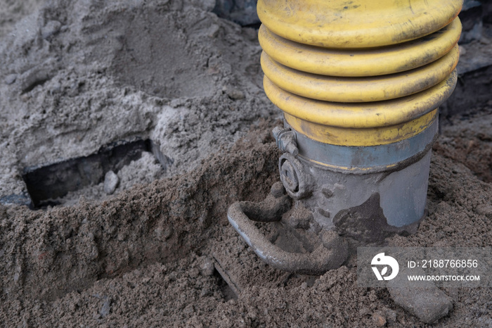 Close-up of a portable vibration rammer or vibrating rammer for tamping the sand before placing the paving stones on top