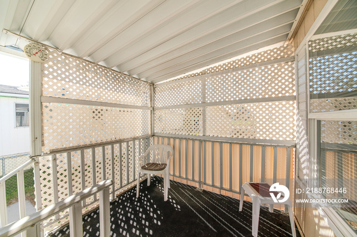 Entrance of a house with lattice privacy wall screen