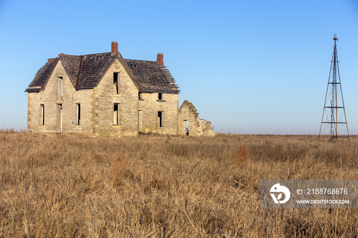 abandoned stone house of Dr. William B. Jones near Florence, Kansas; partial windmill