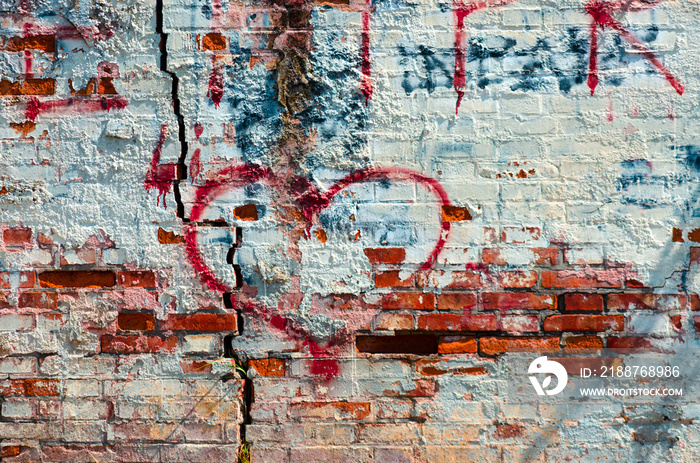 heart shape graffiti on a ruined wall