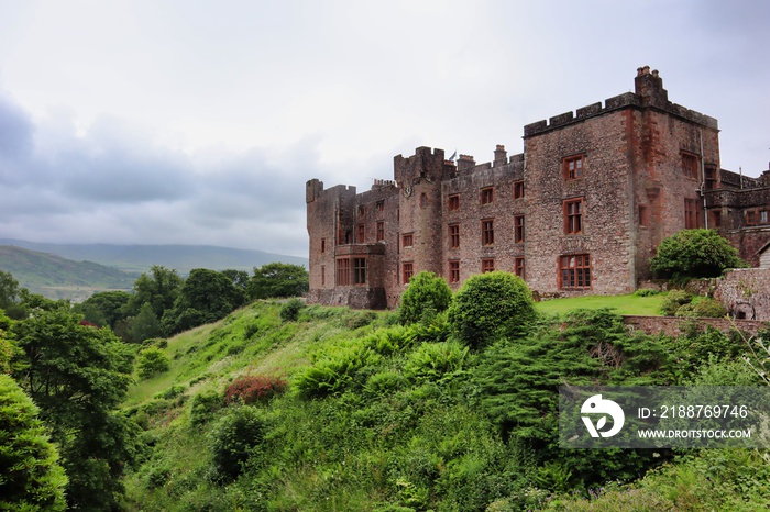 muncaster castle on a hill with view