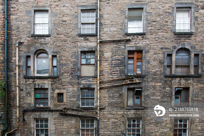 A tenement is a multi-occupancy building of any sort. The term usually refers to a run-down apartment building or slum - Edinburgh,  Scotland.