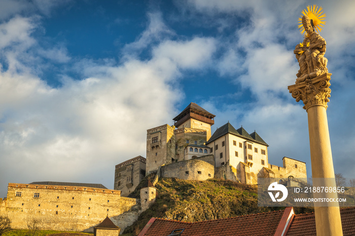 The Trencin Castle above the town of Trencin at sunset, Slovakia, Europe.