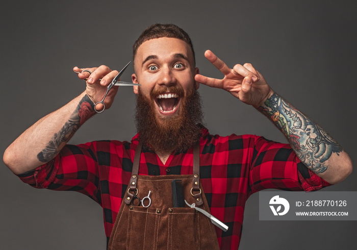 Excited barber gesturing V sign