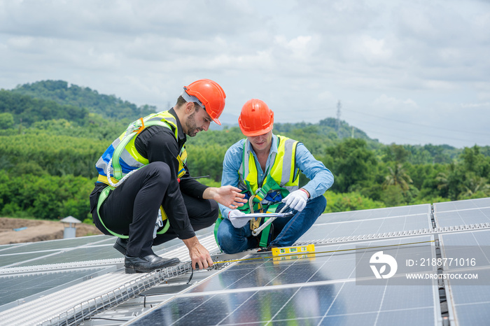 Technician installing the solar panels at roof top,Technician checking Solar panel.