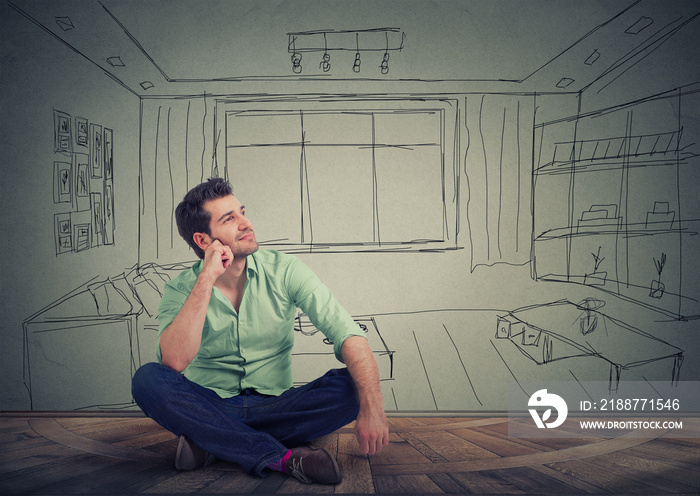 Dreaming man isolated over drawn living room background.