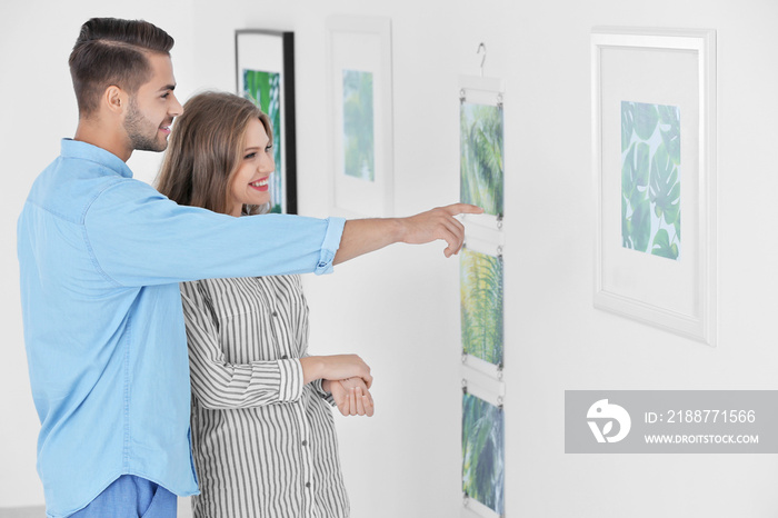 Young couple in art gallery