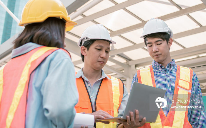 Group of engineer discussing about their construction project outside