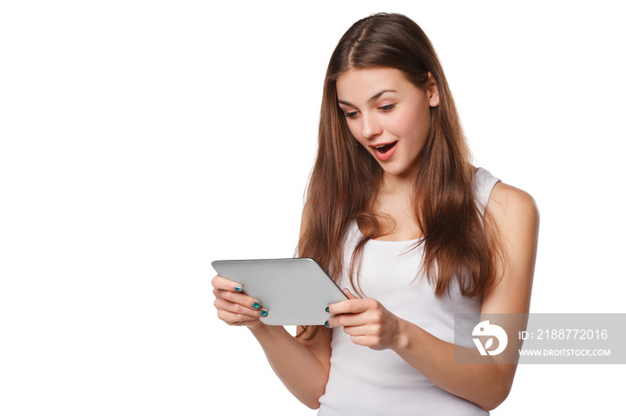 Happy girl using tablet. Excited woman with tablet pc, isolated on white background