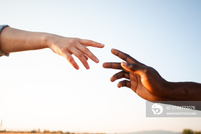 Diverse culture concept. Black man and white woman hands