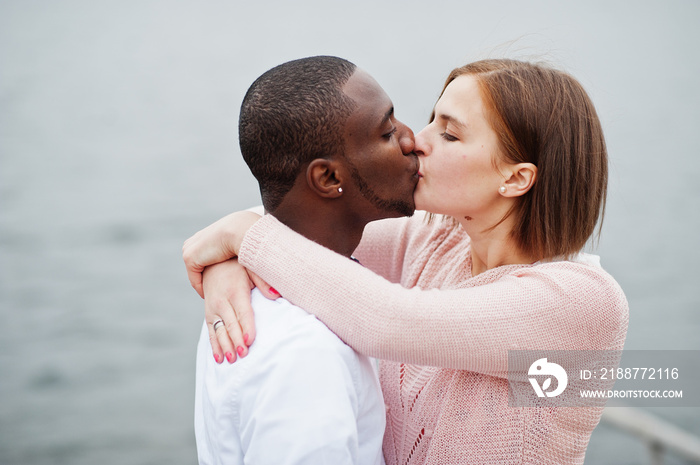 Happy multiethnic couple in love story. Relationships of african man and white european woman.