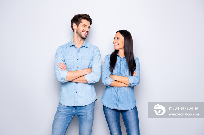 Portrait of his he her she nice attractive lovely cheerful cheery content couple partners leaders best friends wearing casual looking at each other isolated over light white pastel color background