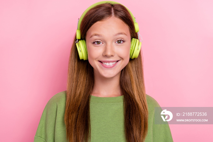 Photo of funky pretty school girl dressed green sweatshirt headphones smiling isolated pink color background