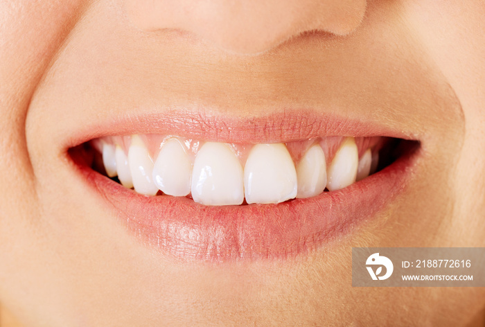 Healthy woman teeth and smile. Isolated over white.