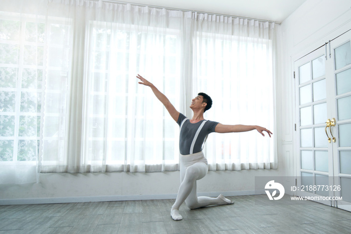 Handsome young male dancer practice dance an exercise at home, social distance during quarantine