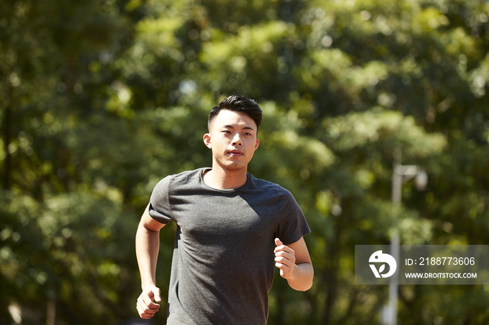 young asian male athlete running