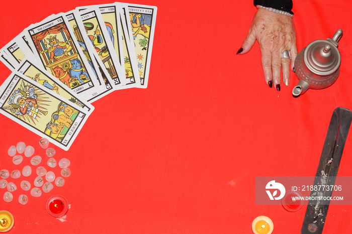 Fortune teller showing tarot cards predicting future.