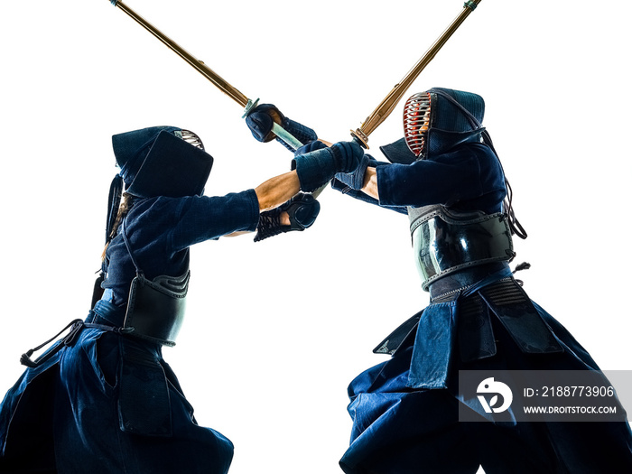 two Kendo martial arts fighters combat fighting in silhouette isolated on white bacground