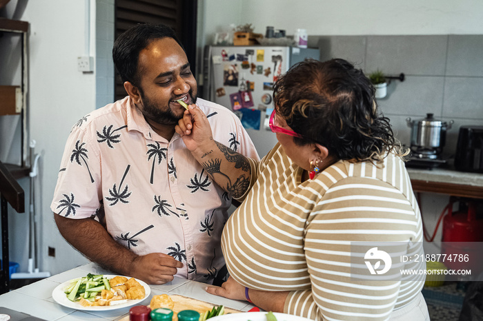 Plus sized parents making a healthy meal for the family