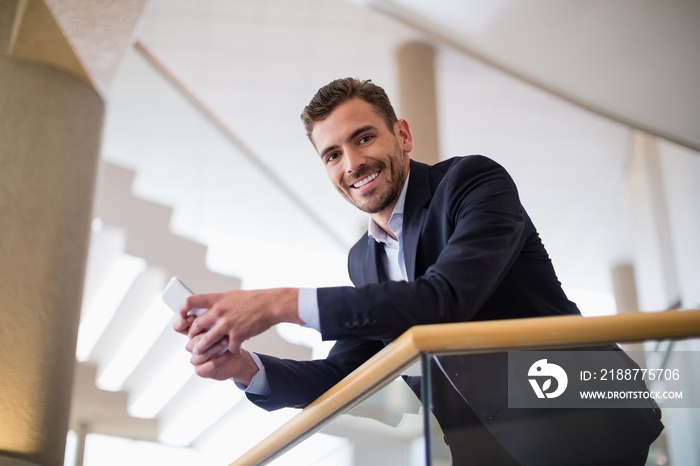 Businessman holding mobile phone