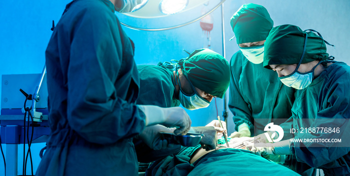 Group of asian doctor and nurse surgeons in hospital operating theater. Medical team performing surgery in operation room.Medical team doing critical operation.health and wellness concept