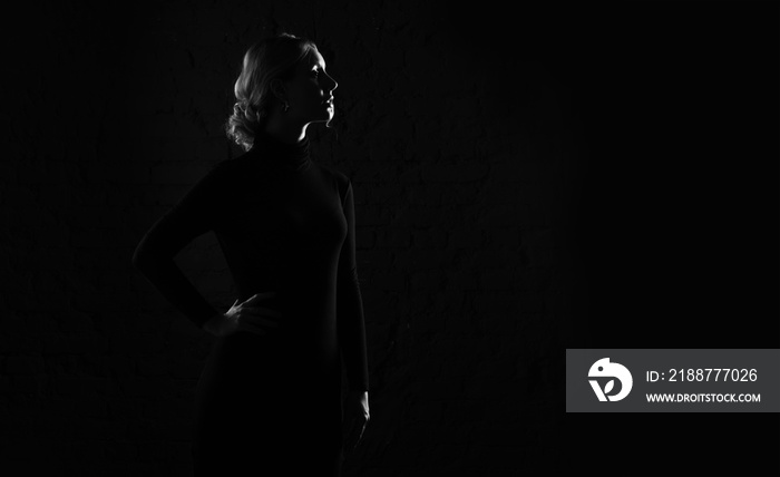 Black and white silhouette profile of a woman.