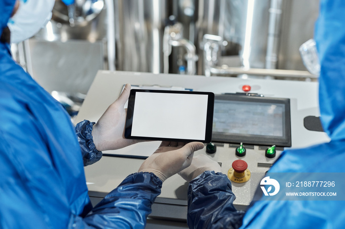 Close up of worker holding digital tablet with white screen mockup