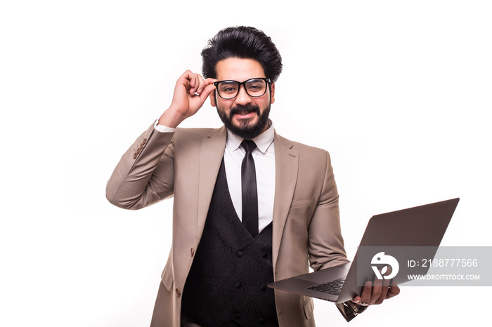 Egiptyan young businessman wearing a suit and holding his laptop isolated on white background.