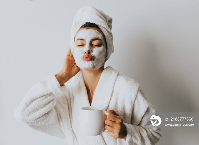 Beautiful Luxury Life. Breakfast. Happy Girl with a Cup of Coffee. Home Style Relaxation Woman Wearing Bathrobe and Towel after Shower. Spa Good Morning.Cosmetic procedure. Beauty spa and cosmetology.