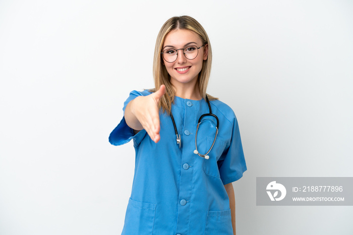 Young surgeon doctor woman isolated on white background shaking hands for closing a good deal