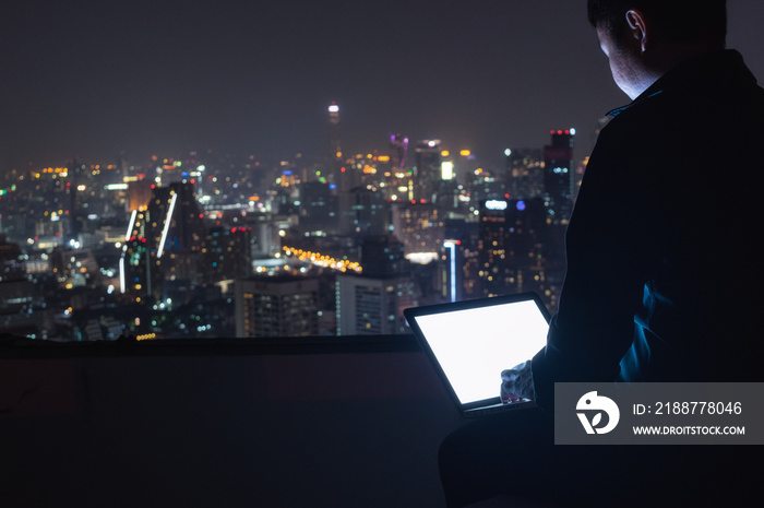 Businessman using laptop computer.