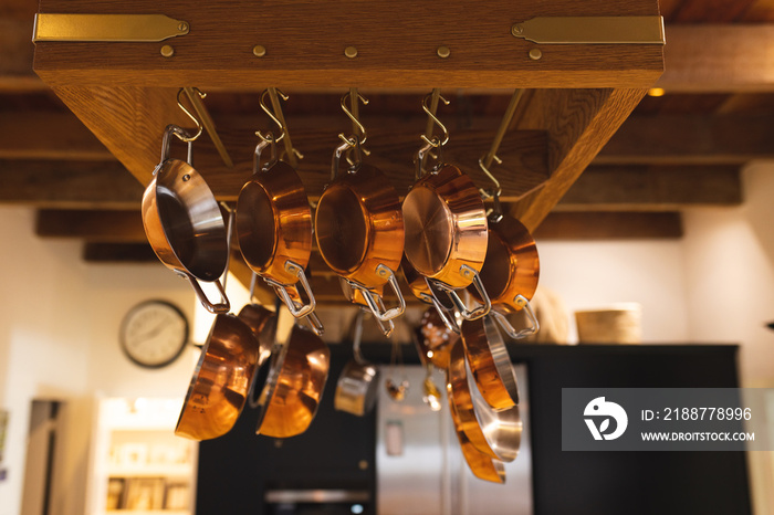 Image of copper pots and plates hanging in kitchen